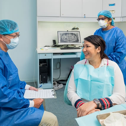 Dentist speaking with client