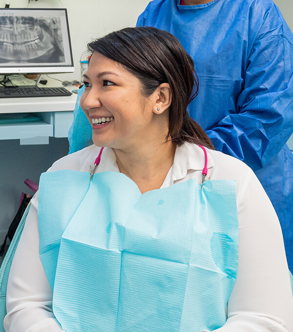 patient smiling in chair