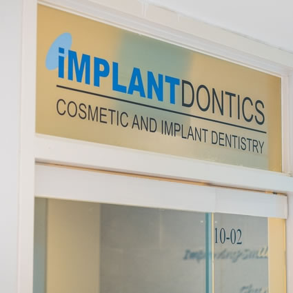 Implantdontics Cosmetic and Implant Dentistry signage